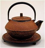 Copper Colored Teapot with Trivet